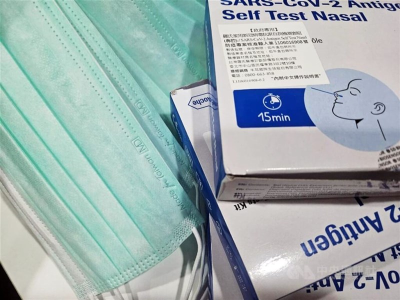 COVID-19 rapid test kits and surgical masks. CNA file photo